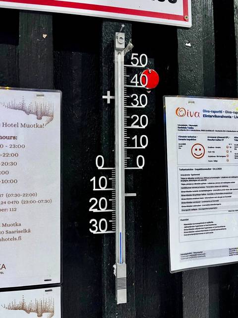 A close-up of a thermometer showing a cold weather reading.