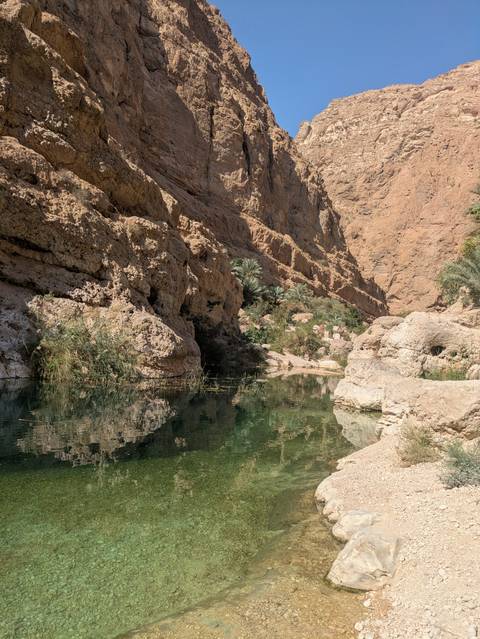 Scenic view of a rocky canyon with a reflection on the water surface.