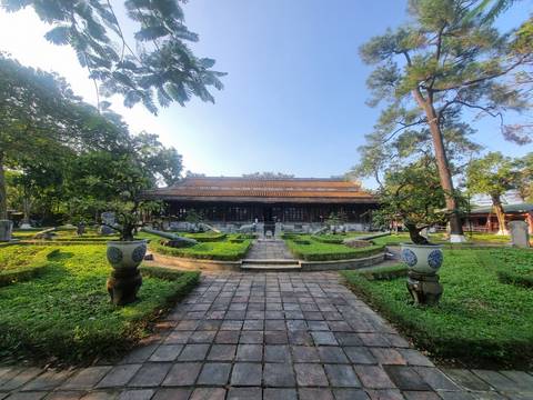 Traditional building in a garden setting.