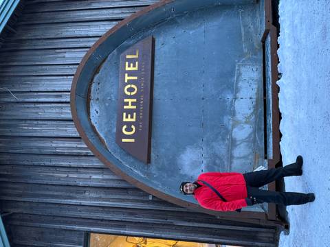 Person standing outside the Ice Hotel entrance.