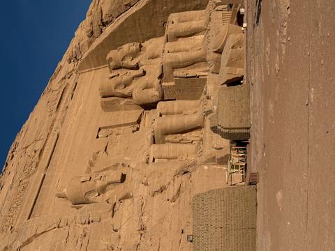 Abu Simbel temples with blue sky and shadows.