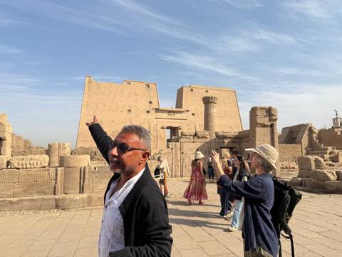 Tourists exploring an ancient temple site.