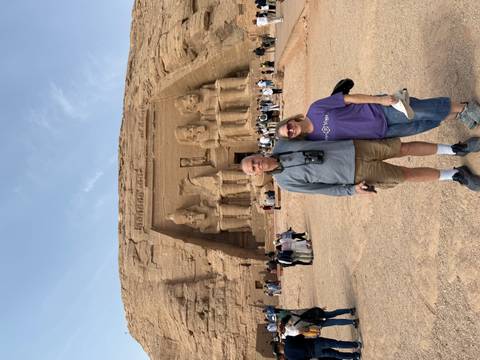 A couple posing in front of the Abu Simbel temples.