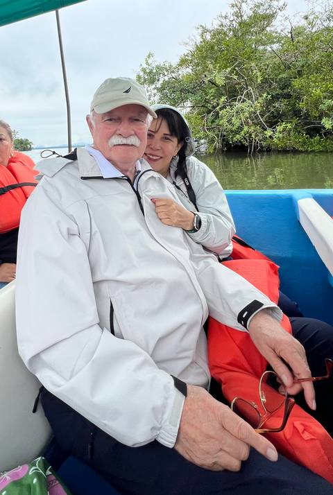 Couple seated in a boat during a river tour.