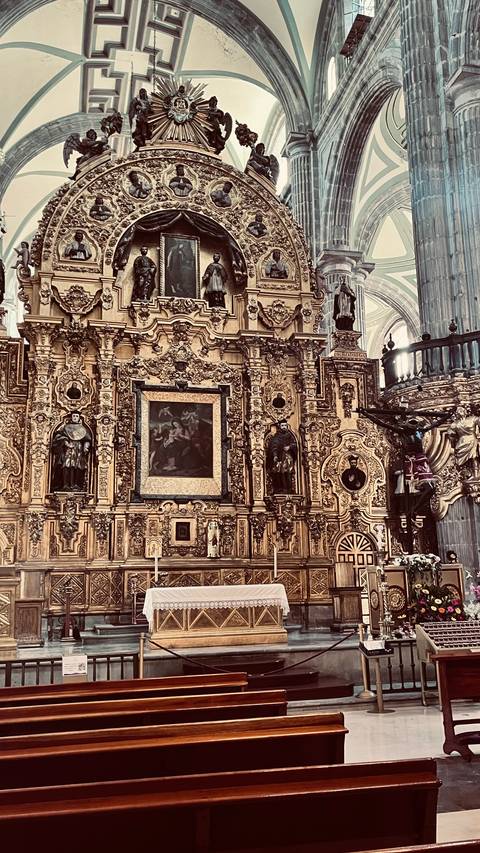       Intricately decorated altar inside a cathedral.
  