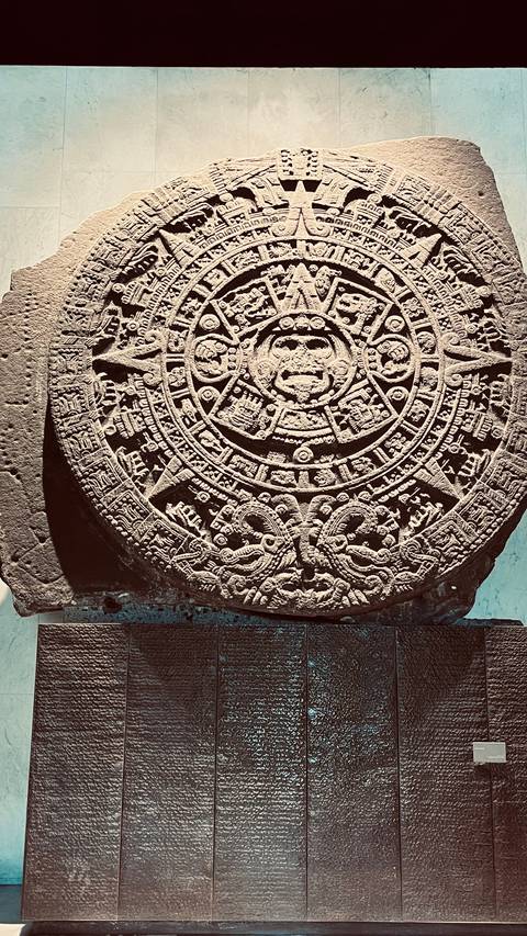       Ancient Aztec calendar stone artifact.
  