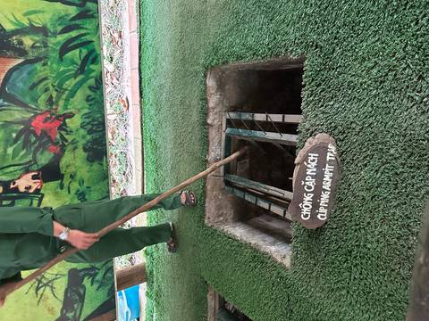 Person demonstrating the use of a historical trap