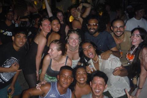Group of people enjoying a festive night out with drinks
