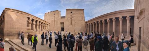 Tourists exploring ruins of an ancient temple.