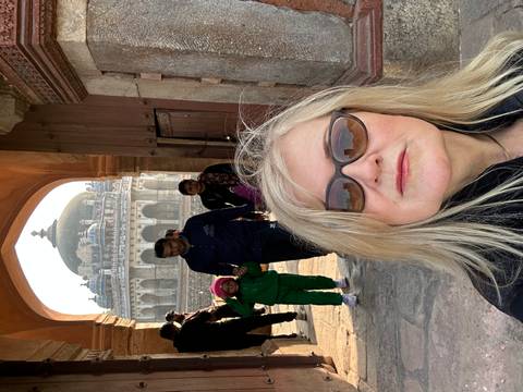 Tourists in front of historic architecture.