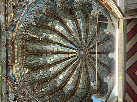 Intricate dome ceiling with detailed mosaics.