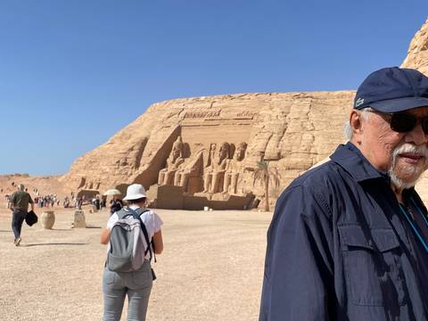 Tourists walking outside the ancient ruins of Abu Simbel.