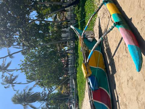 Colorful traditional boat on a sunny beach.
