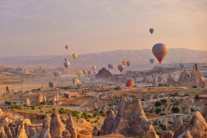       Hot air balloons over the rock formations of Cappadocia.
  