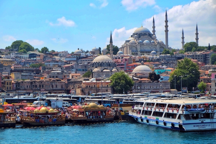 The bustling waterside view of Istanbul with mosques.