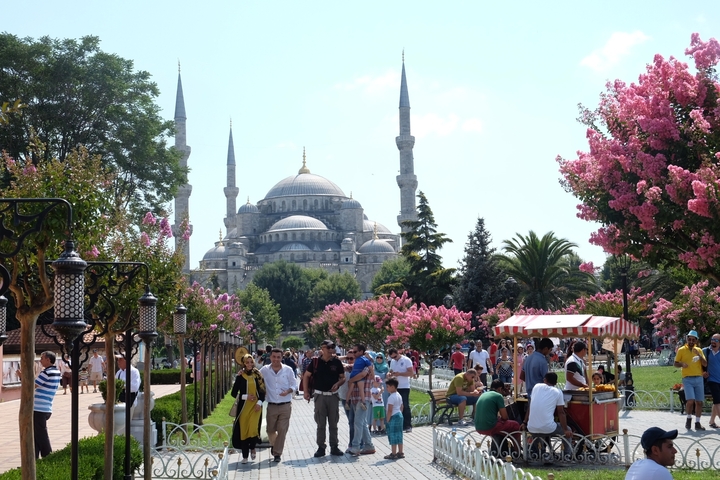 People enjoying the gardens near the Blue Mosque.