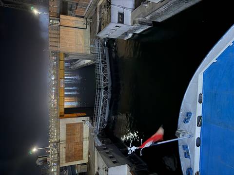       Night view from a cruise ship entering a lock on the Nile.
  