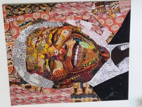       Colorful mixed-media portrait painting of Nelson Mandela on display inside an art gallery.
  