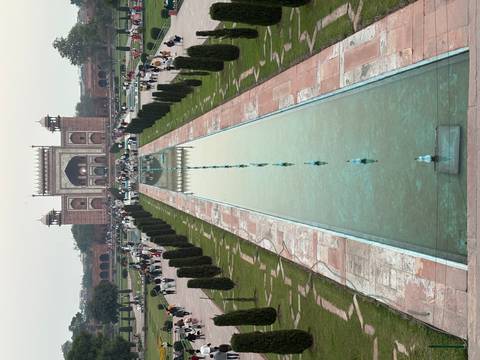       Long axial pool leads to the grand entrance gate opposite the Taj Mahal complex.
  