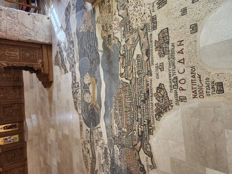       Ancient mosaic floor map depicting biblical geography inside a historic church in Madaba
  