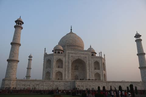       Side angle of the Taj Mahal at dusk with soft pastel sky.
  
