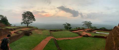       Panoramic view across the ancient ruins atop Sigiriya Rock at sunset.
  