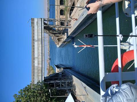       Navigational lock on the Nile viewed from a cruise ship deck with blue water channel.
  