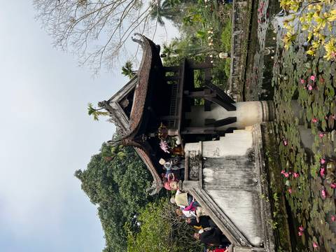       Historic One Pillar Pagoda rising over a pond of lotus flowers in Hanoi.
  