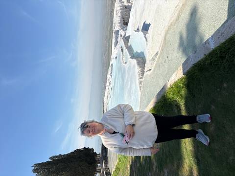       Visitor looks across the glistening white travertine pools of Pamukkale.
  