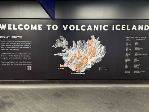       Large informational wall map titled “WELCOME TO VOLCANIC ICELAND” with eruptive zones highlighted in orange
  