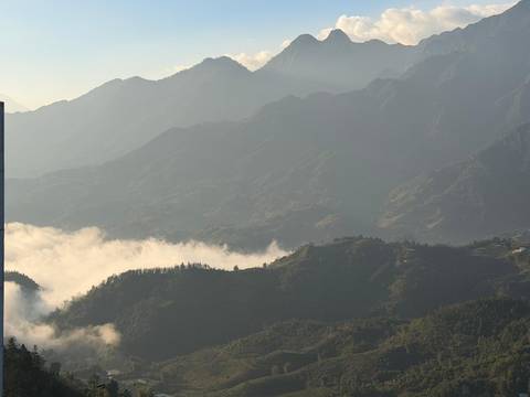      Misty mountain valleys with layers of peaks and morning fog, Sapa region.
  