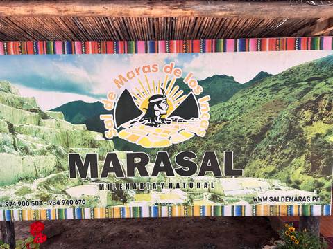       Printed information sign advertising Maras salt with graphics and website details.
  