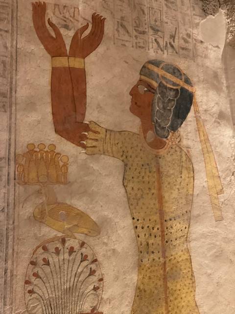       Detail of colorful ancient Egyptian wall painting inside a tomb or temple.
  