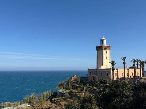       Coastal lighthouse overlooking the Atlantic Ocean on a clear day.
  