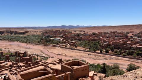       Panoramic view of Aït Benhaddou village and surrounding arid valley.
  