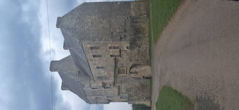       Grey stone Midhope-style castle with stepped gables under brooding sky at end of track.
  
