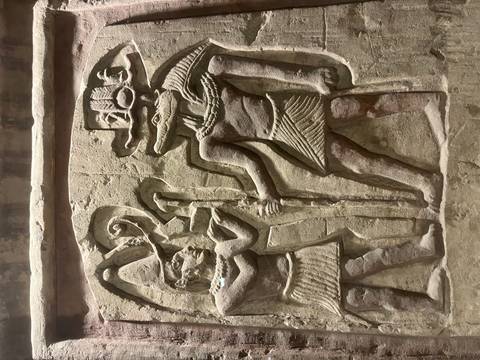       Stone relief showing Sobek and another figure in an Egyptian temple.
  