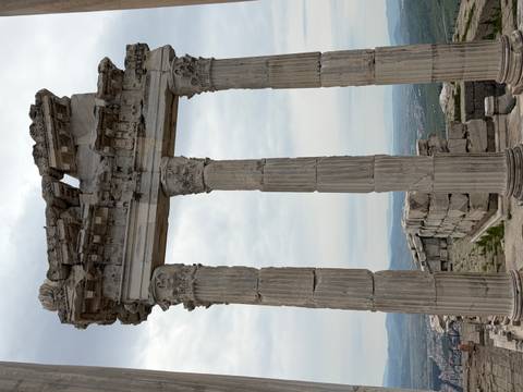       Tall Corinthian columns and ruined entablature of Pergamum’s Temple of Trajan
  