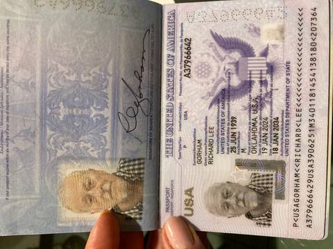       Detailed image of an identification page inside a passport with photo and security elements.
  