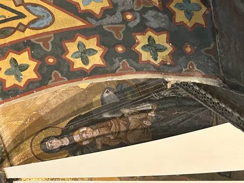       Colourful Byzantine fresco of Madonna and Child inside a cave church.
  