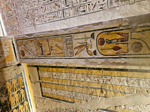       Detail of colourful ancient Egyptian hieroglyphic wall paintings inside a tomb
  