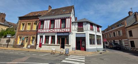       Charming timbered art gallery buildings at a small French crossroads.
  