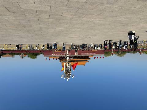       Crowds gather in Tiananmen Square facing the Gate of Heavenly Peace under a crisp blue sky.
  