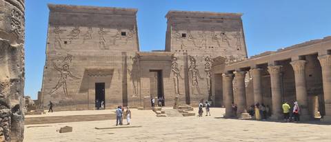       Ancient relief-covered pylons and columned courtyard of Philae Temple
  