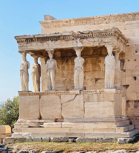       Marble Caryatid statues supporting the porch of the Erechtheion on the Acropolis
  