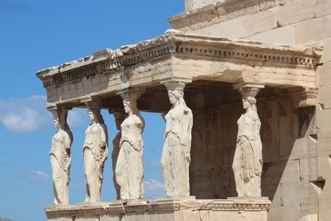       The Caryatid Porch of the Erechtheion features five elegant marble maidens supporting an ornate stone entablature.
  