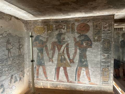       Intricately painted figures and hieroglyphs on the walls of a tomb in the Valley of the Kings.
  