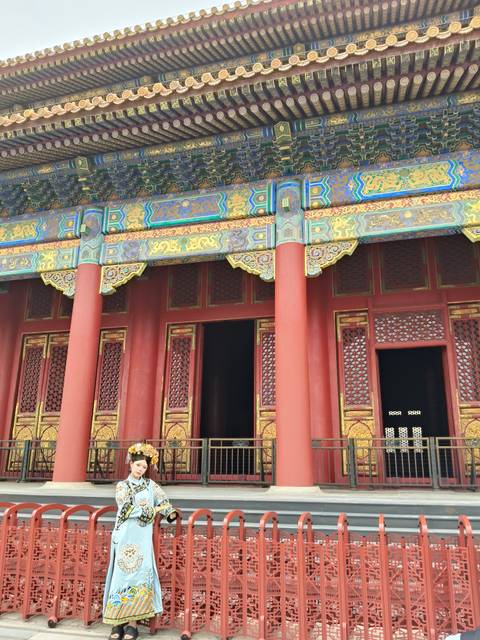       Detail of ornate red and gold architecture in the Forbidden City
  
