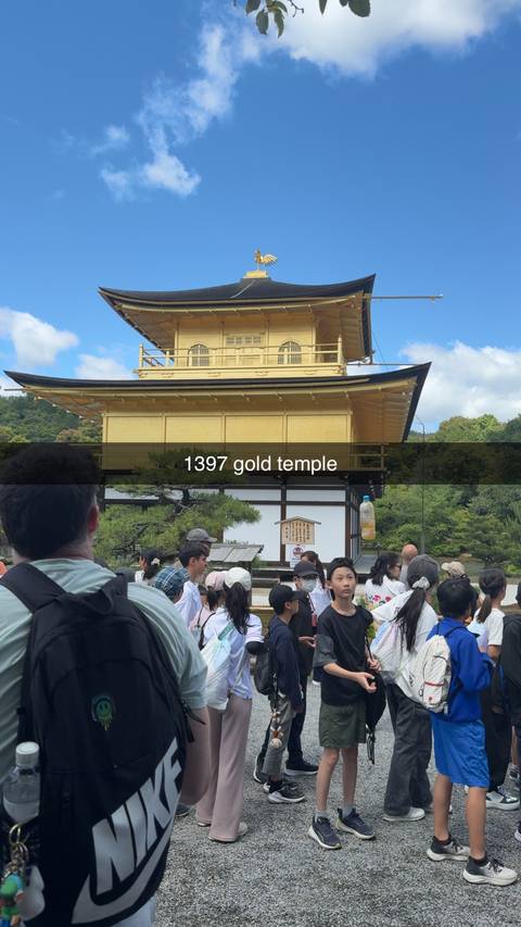       Golden Pavilion temple in Kyoto with large crowd in foreground and overlay text across the image.
  