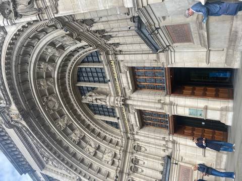       Grand arched entrance of the Victoria and Albert Museum in London.
  